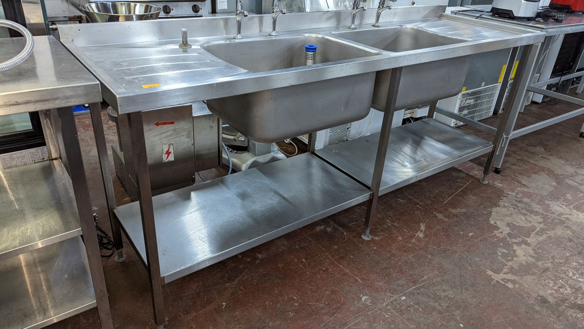 Large stainless steel twin bowl sink arrangement incorporating taps, drainers & shelves below, max e - Image 2 of 6