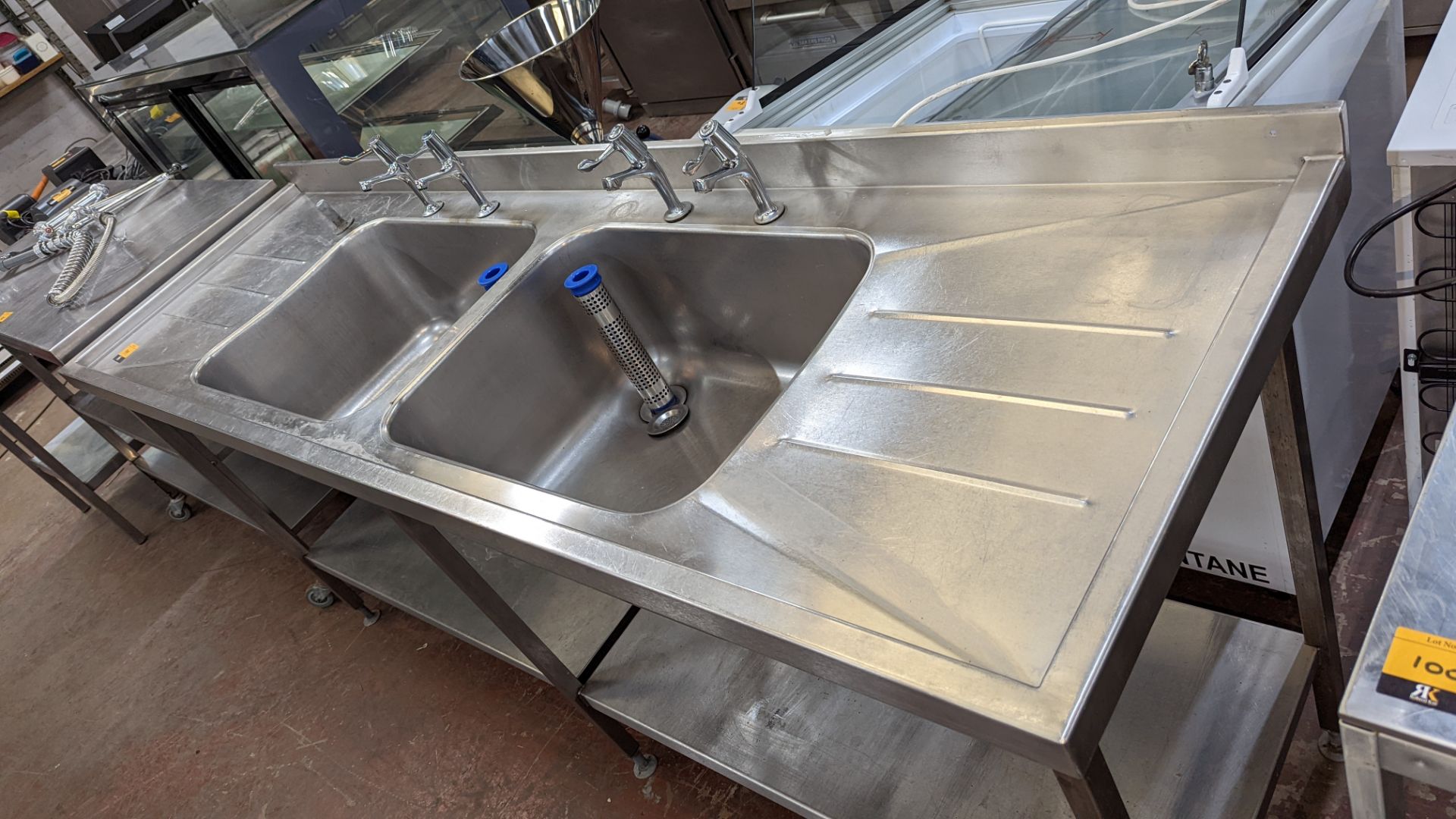 Large stainless steel twin bowl sink arrangement incorporating taps, drainers & shelves below, max e - Image 5 of 6