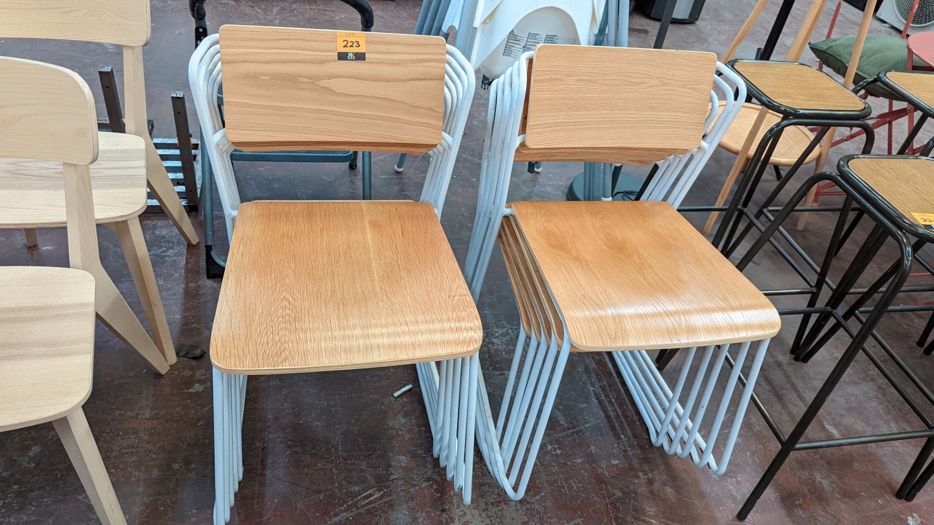 10 off matching stacking chairs comprising white metal frames & wooden backs/bases