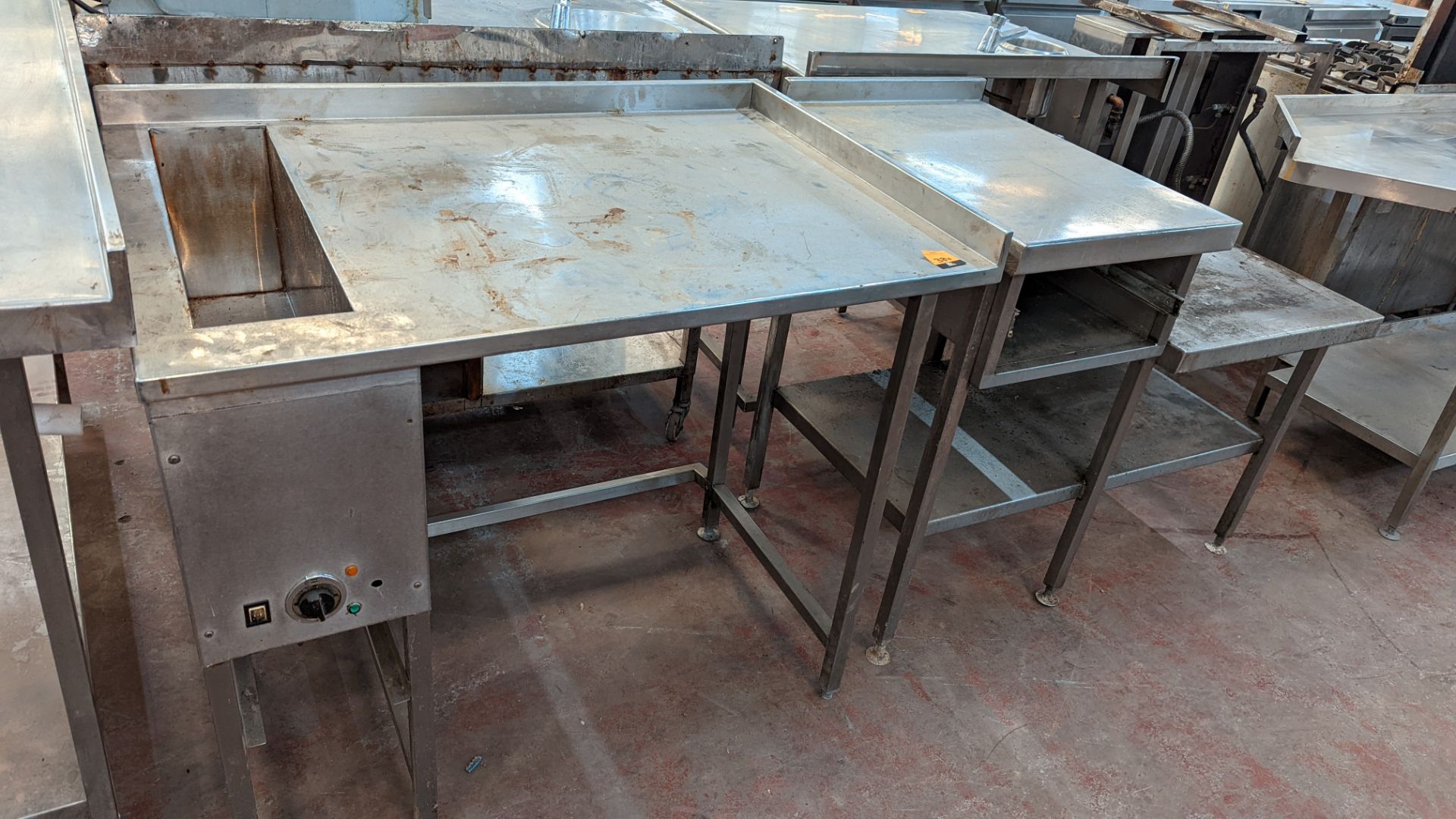 2 off unusually shaped stainless steel tables