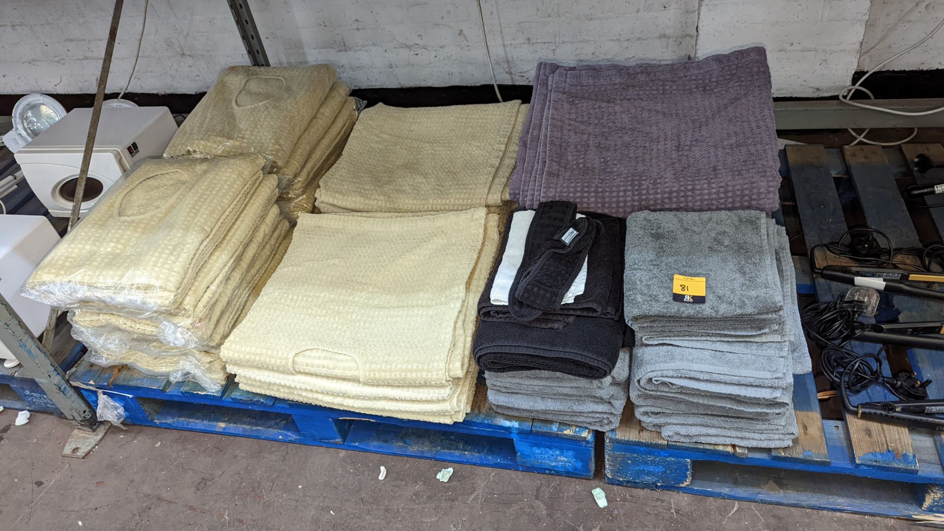 Quantity of towels, mostly designed for use with beauty treatment beds, some of which are in sealed