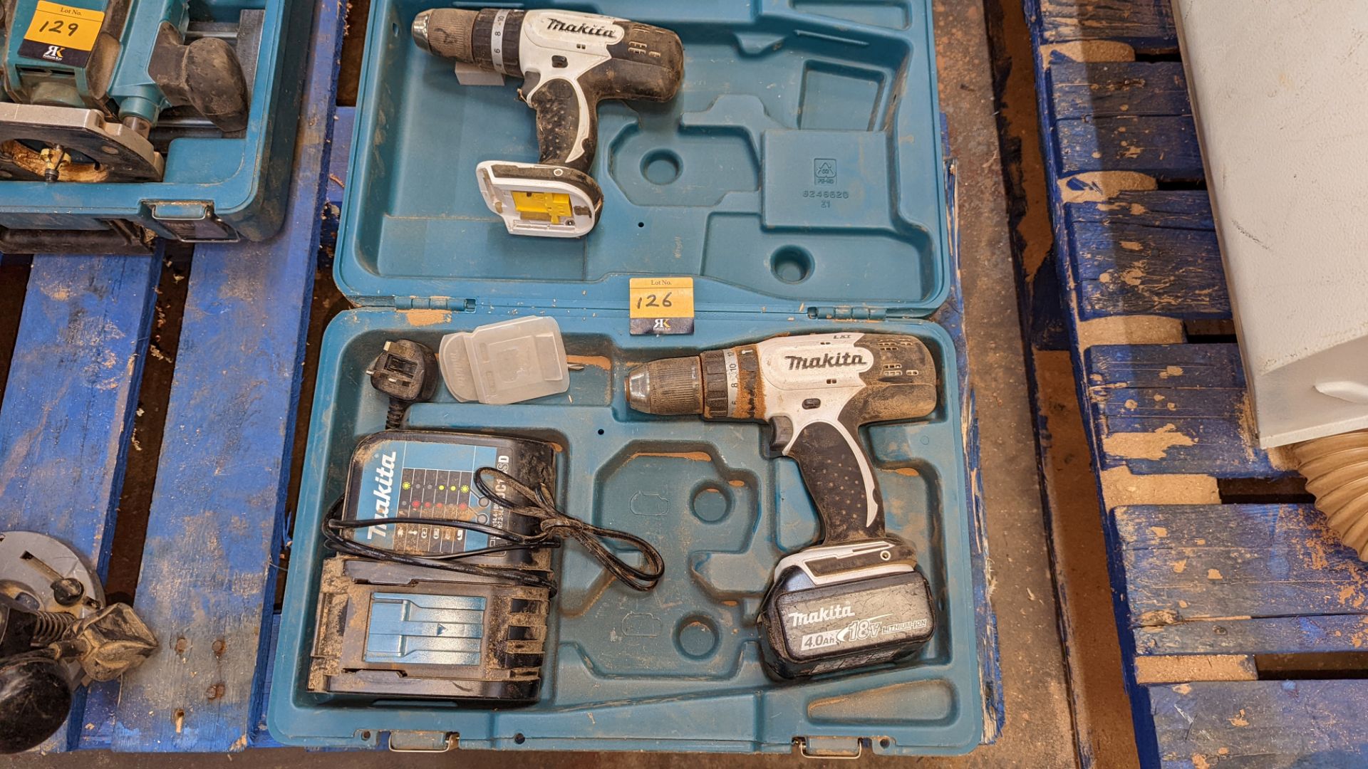 Cordless Makita power tool lot comprising 2 off DHP453 drills, 1 off 18v battery, 1 off DC18SD charg