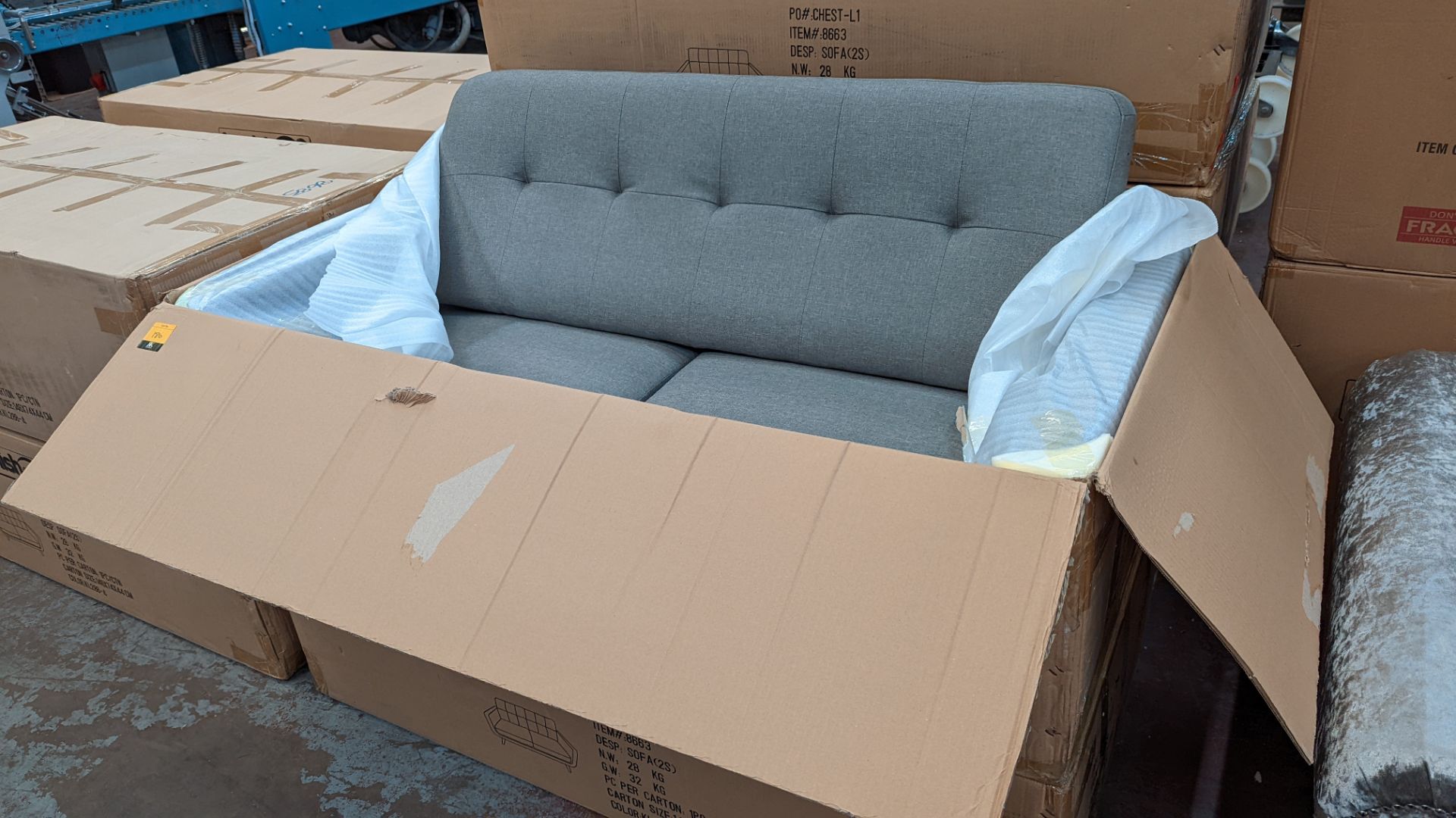 Sofa upholstered in fabric with wooden legs. This item is boxed & requires assembly. Please see th