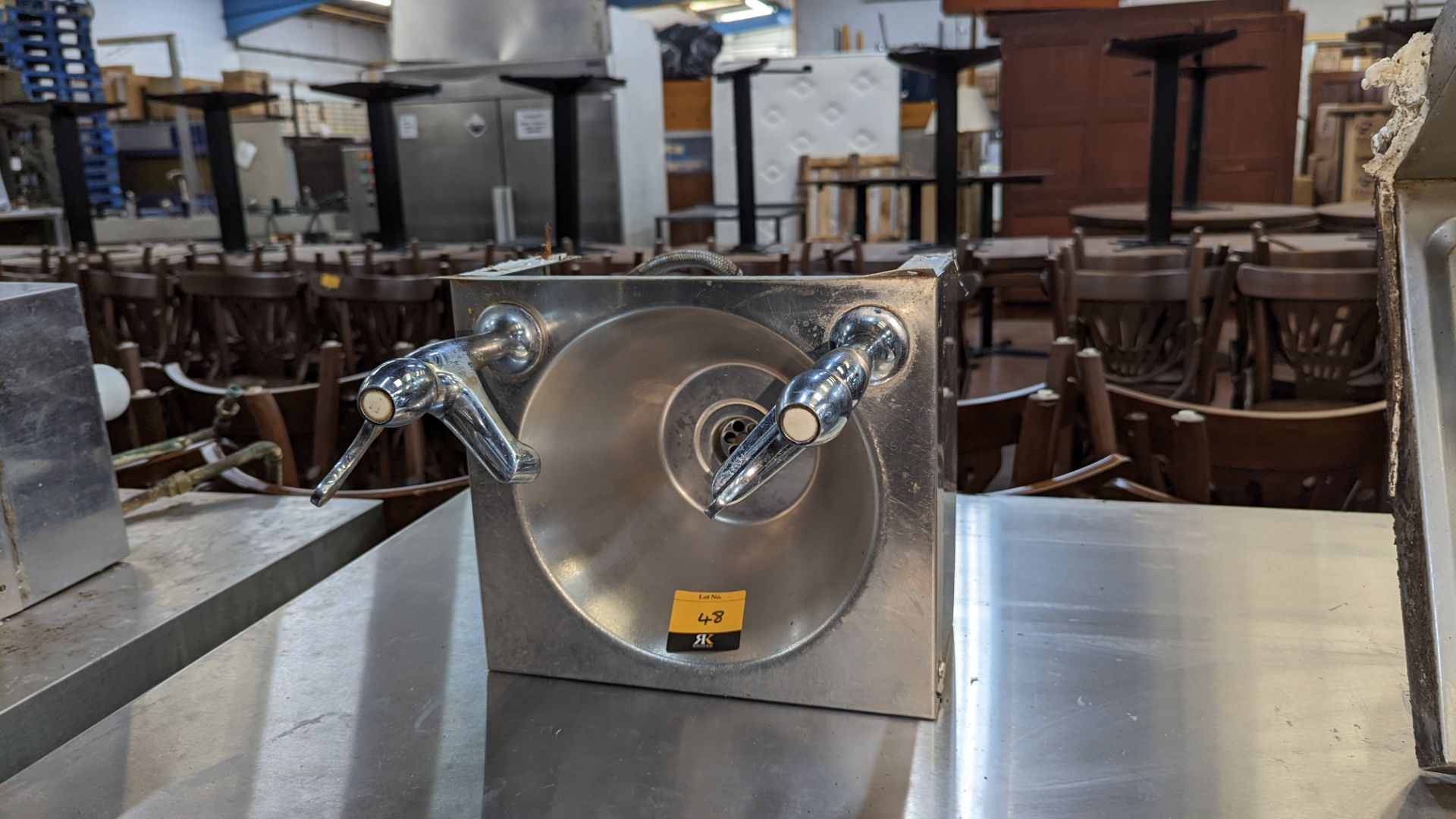 Stainless steel handwashing basin with taps