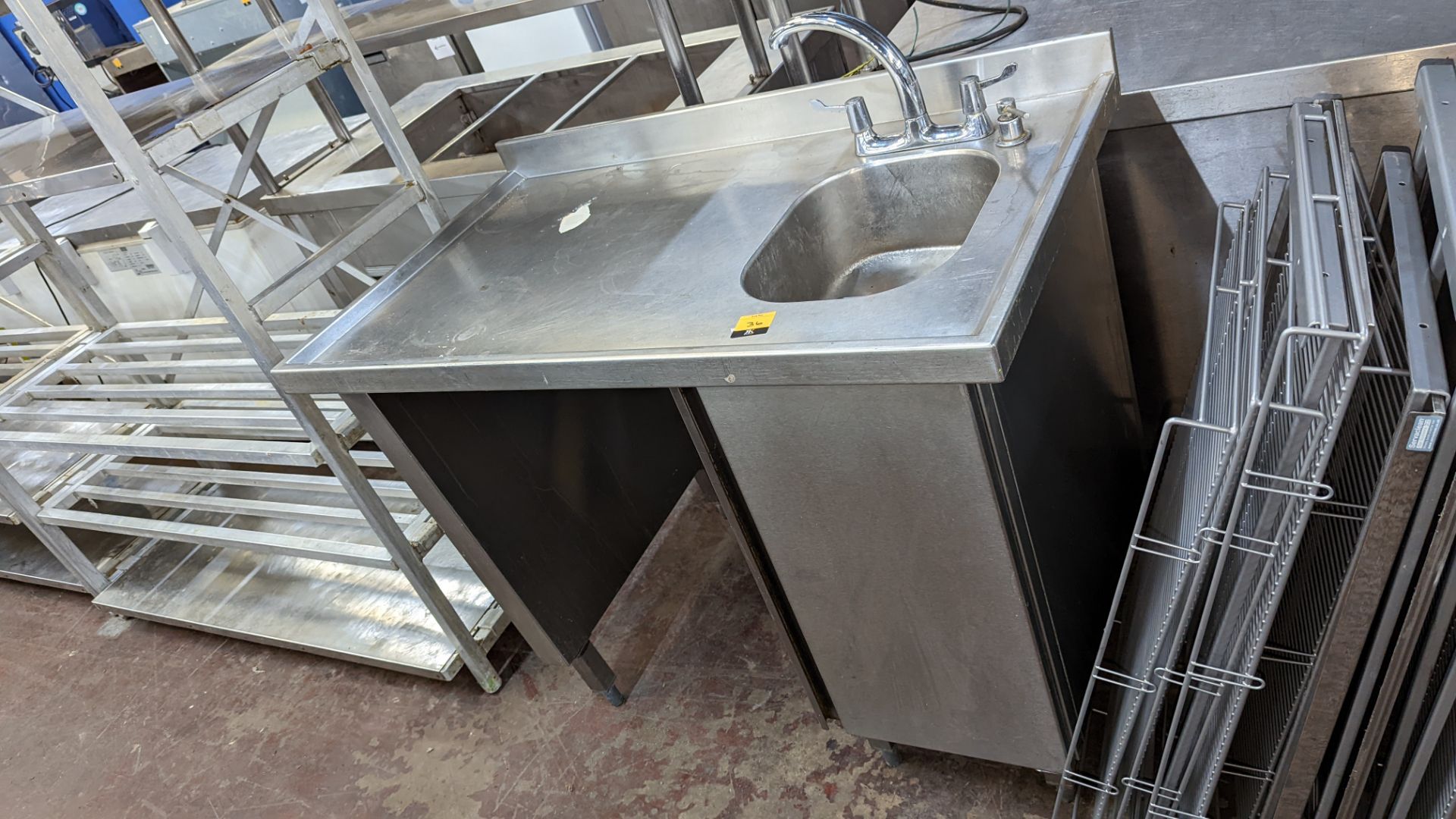 Stainless steel freestanding sink & drainer arrangement including storage below