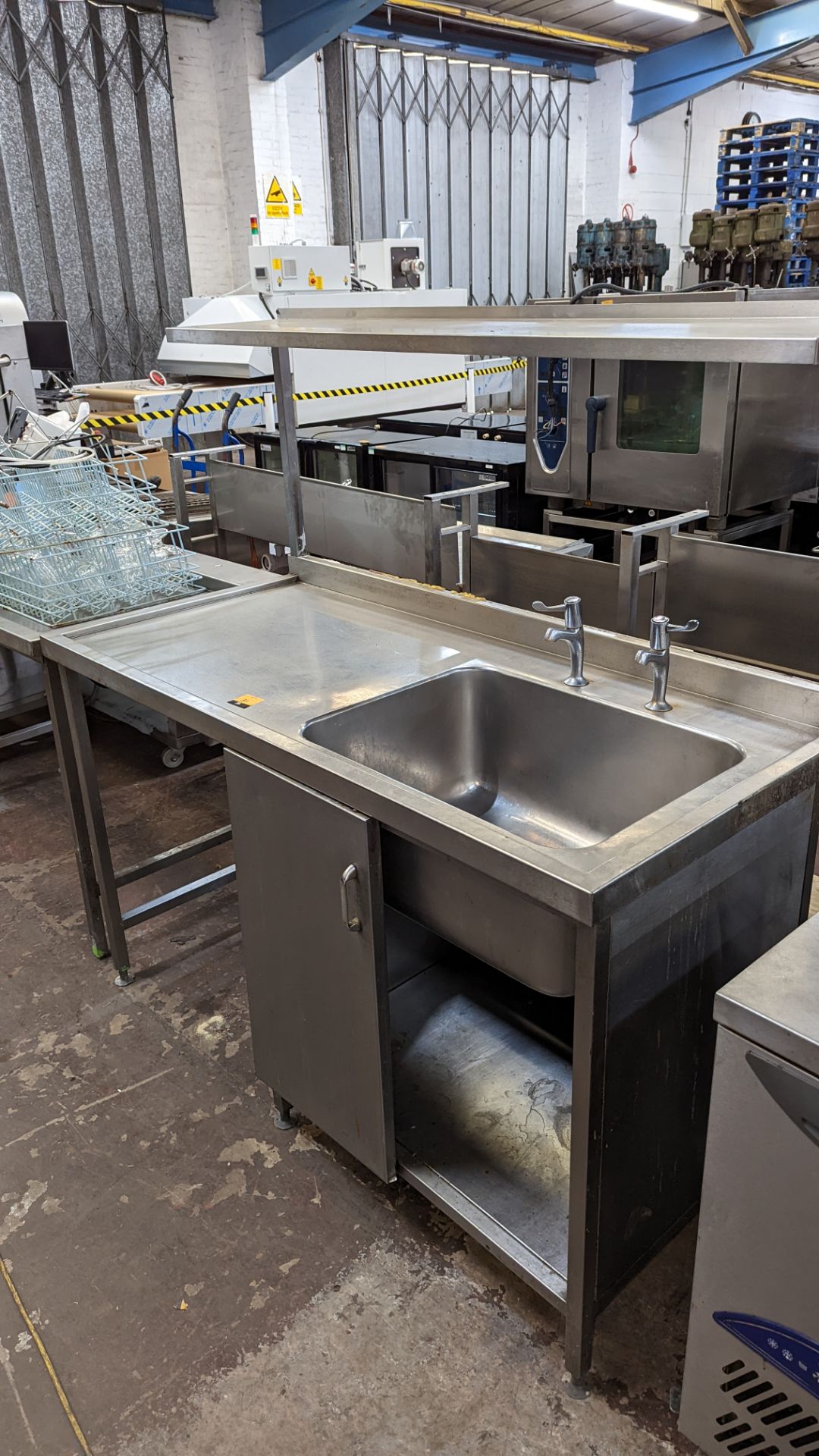 Stainless steel freestanding single bowl sink with large drainer, shelf above & storage below