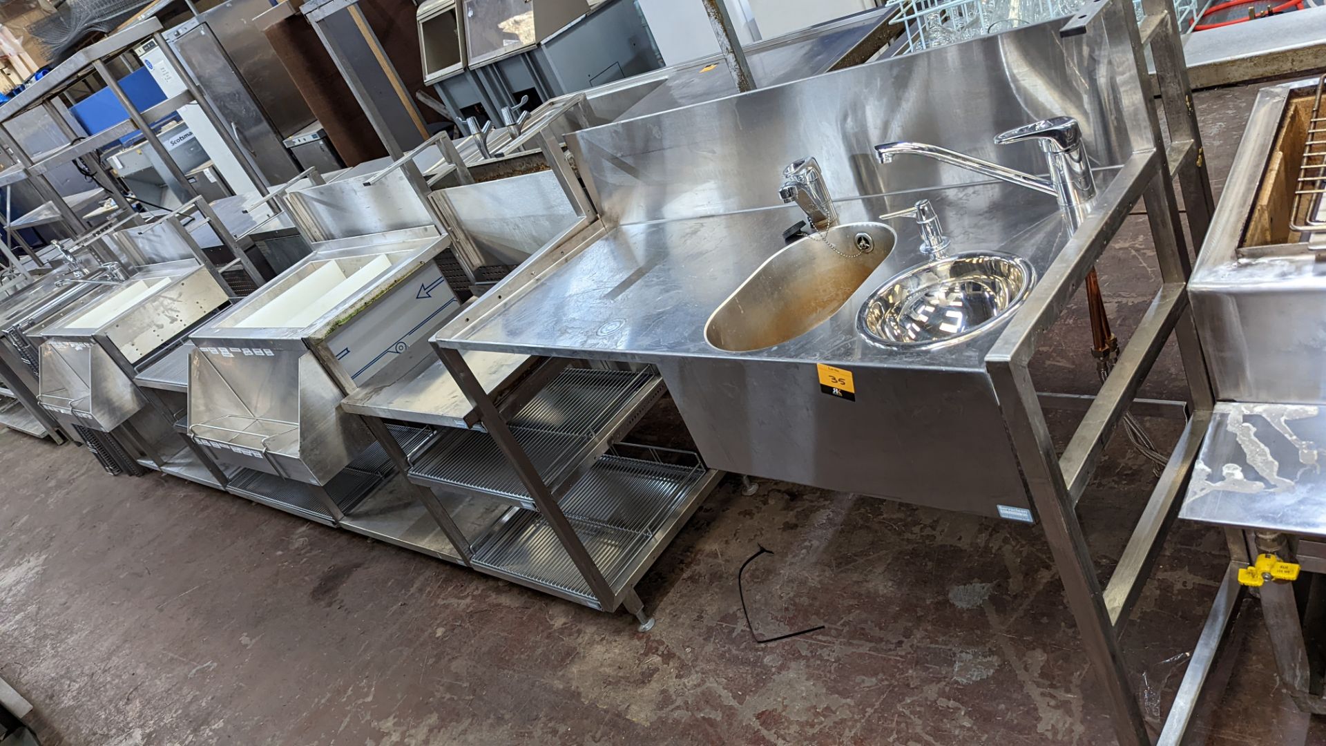 Large quantity of stainless steel modular bar fittings comprising multi-bowl sink unit, shelving uni