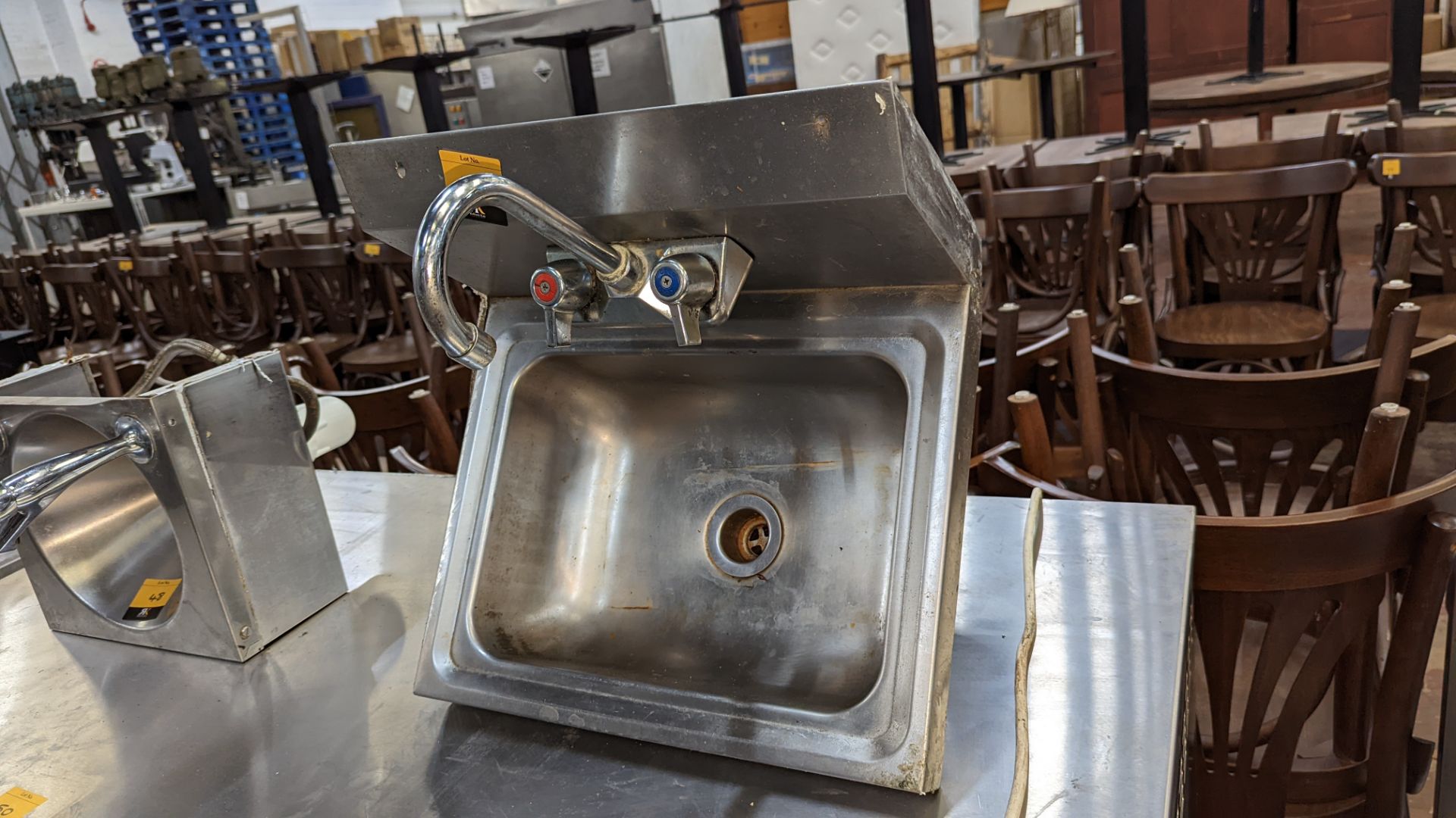 Stainless steel handwashing basin with taps