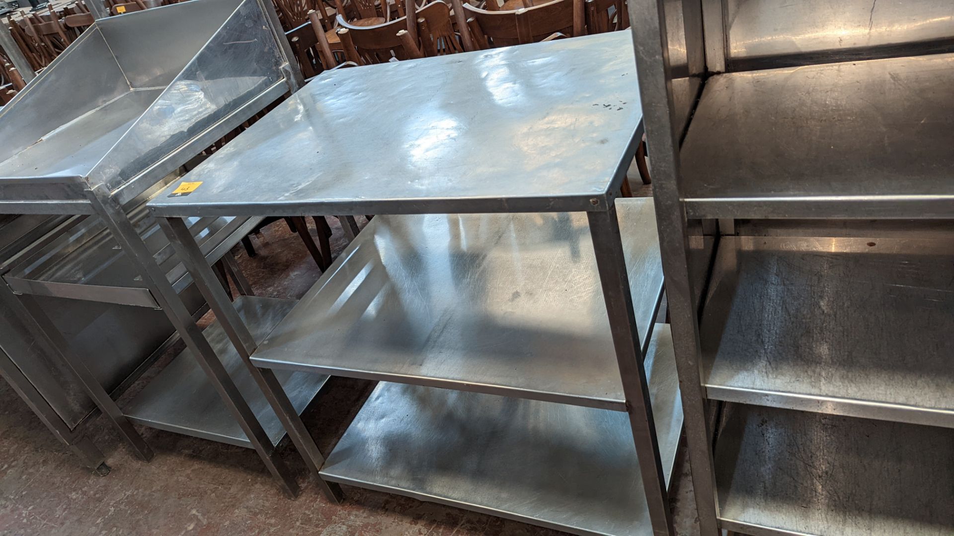 Stainless steel triple-tier shelving unit