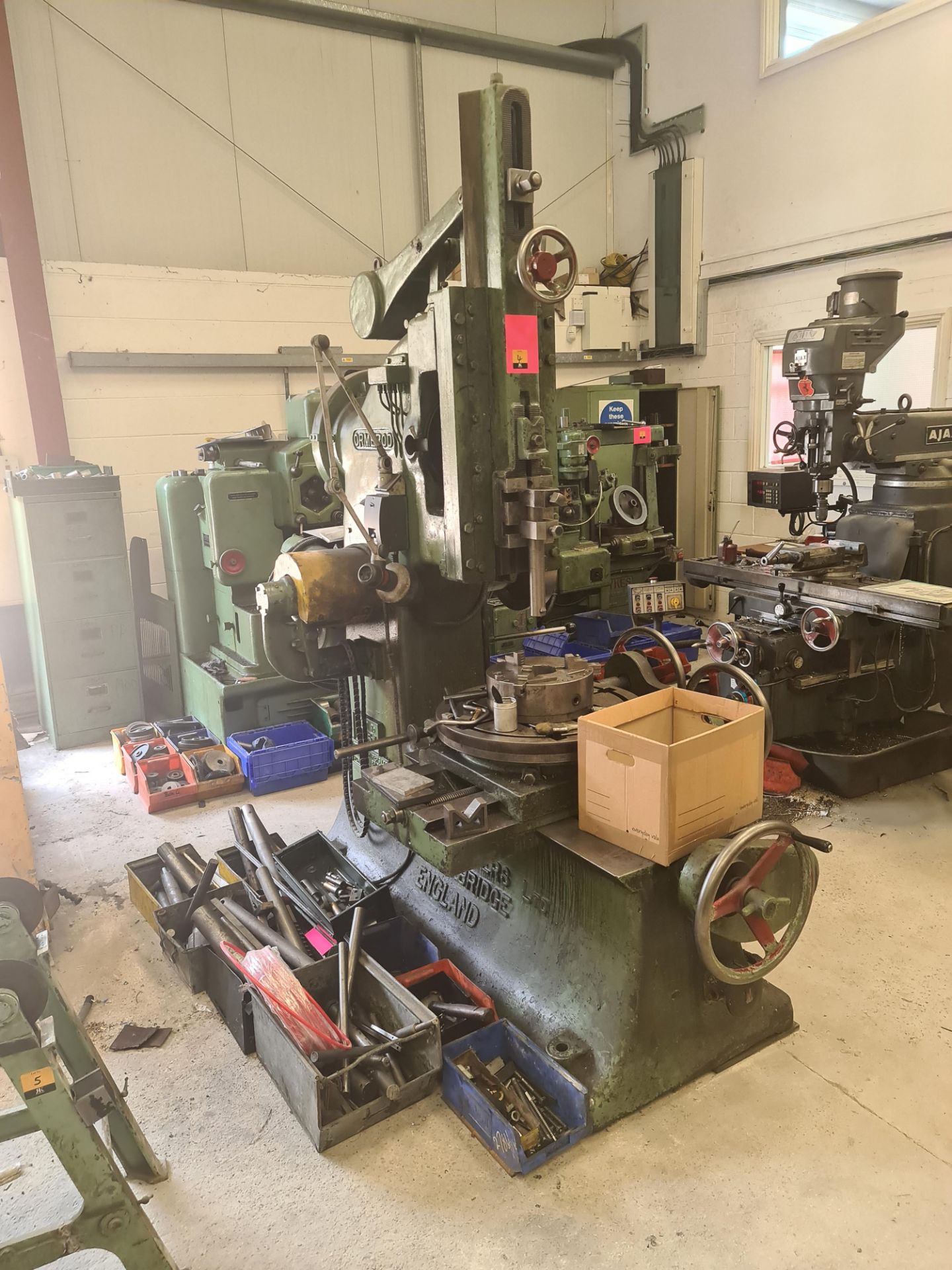 Ormerod slotting machine (machine number 4981) including the crates of tooling located immediately a