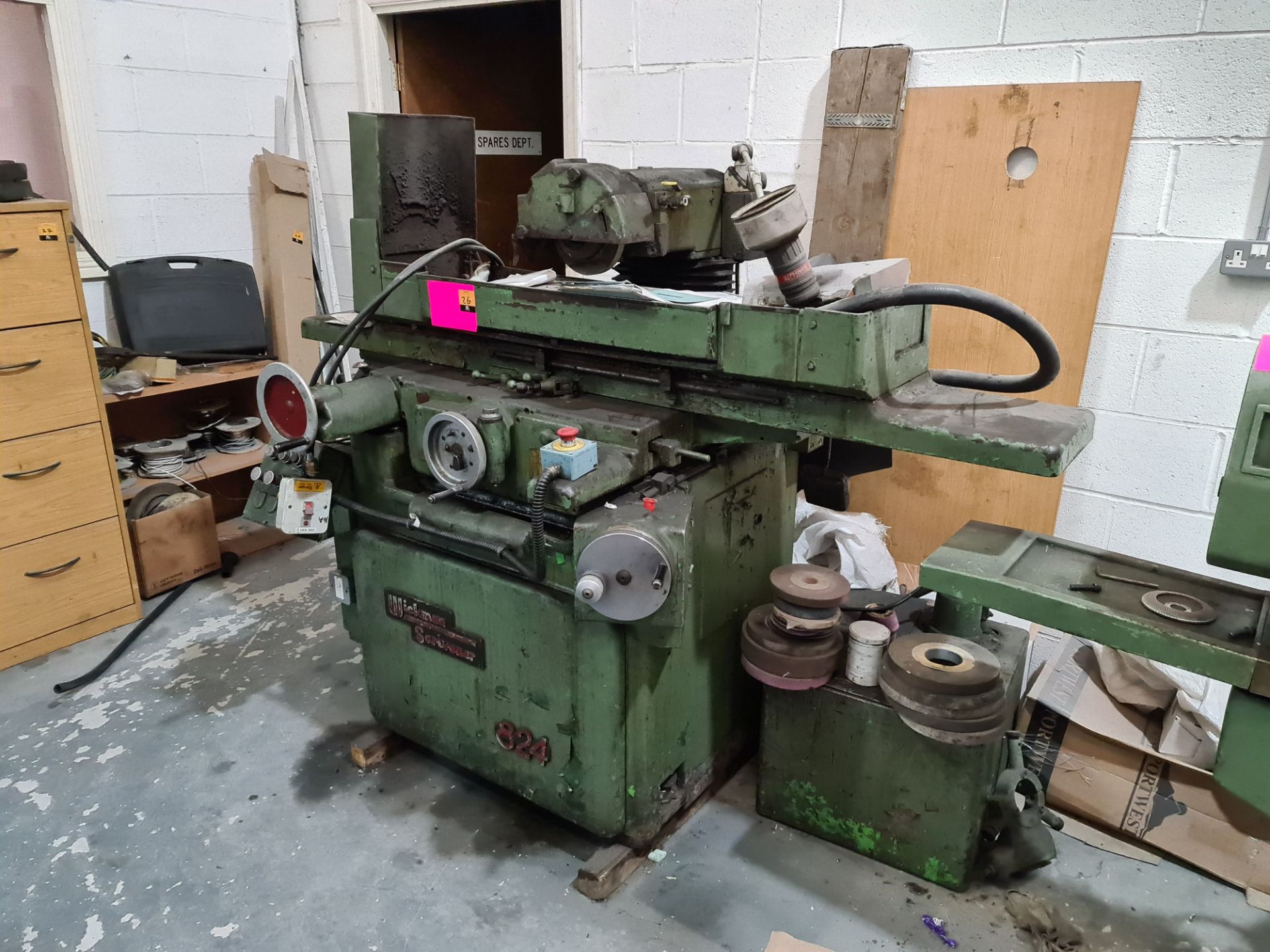 Wickman Scrivener 824 surface grinding machine with 24" x 8" magnetic chuck. Includes cooling box,