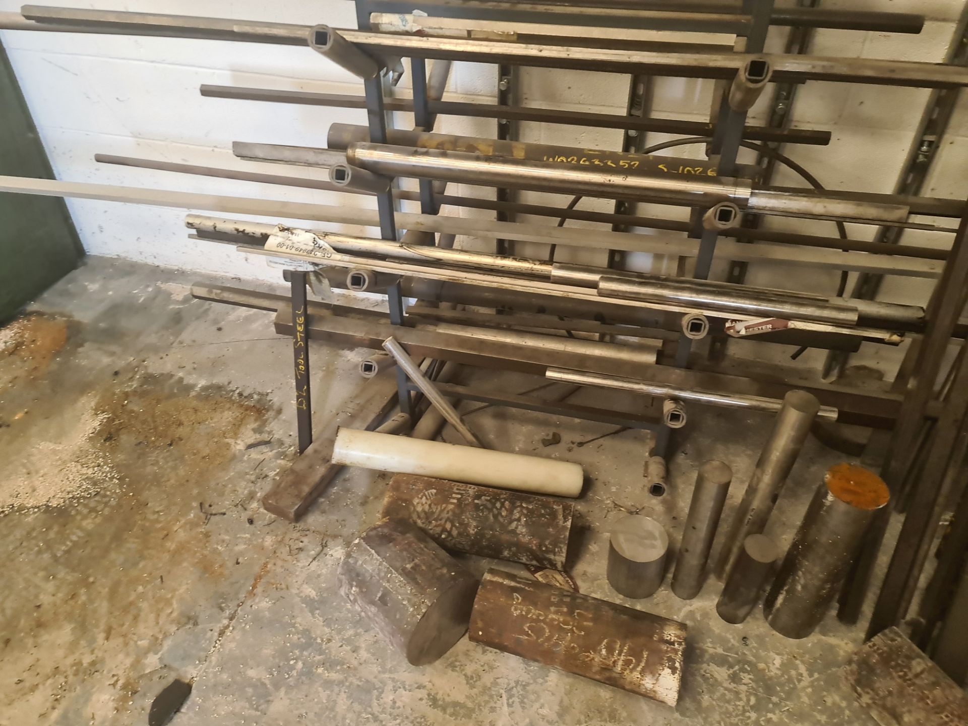 Quantity of rod & bar stock comprising 2 stands & their contents plus the loose metal located adjace - Image 15 of 18