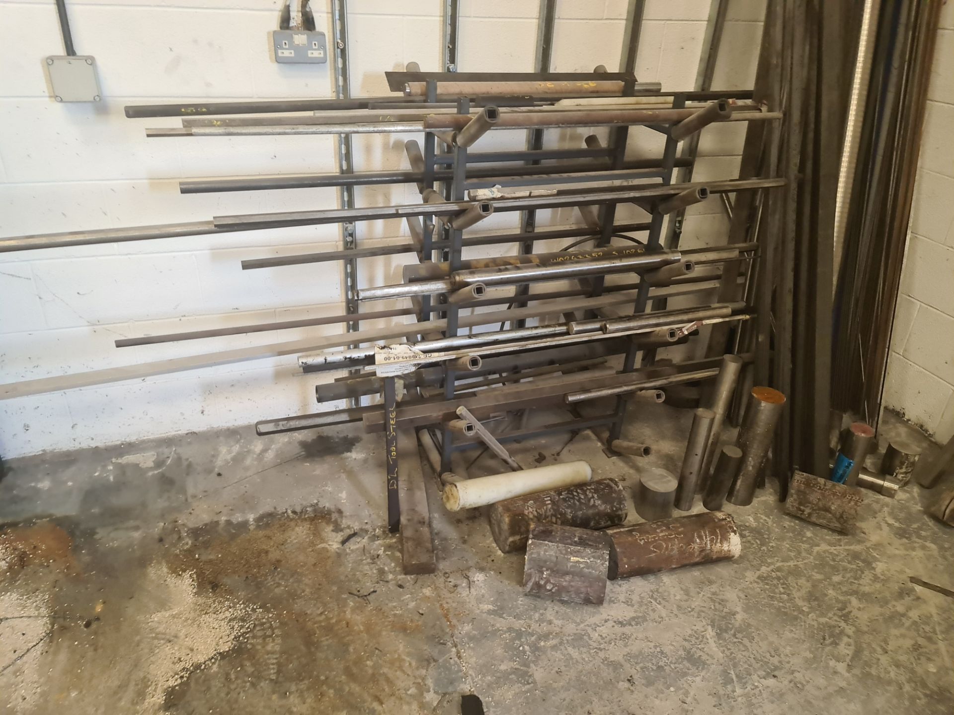 Quantity of rod & bar stock comprising 2 stands & their contents plus the loose metal located adjace - Image 2 of 18