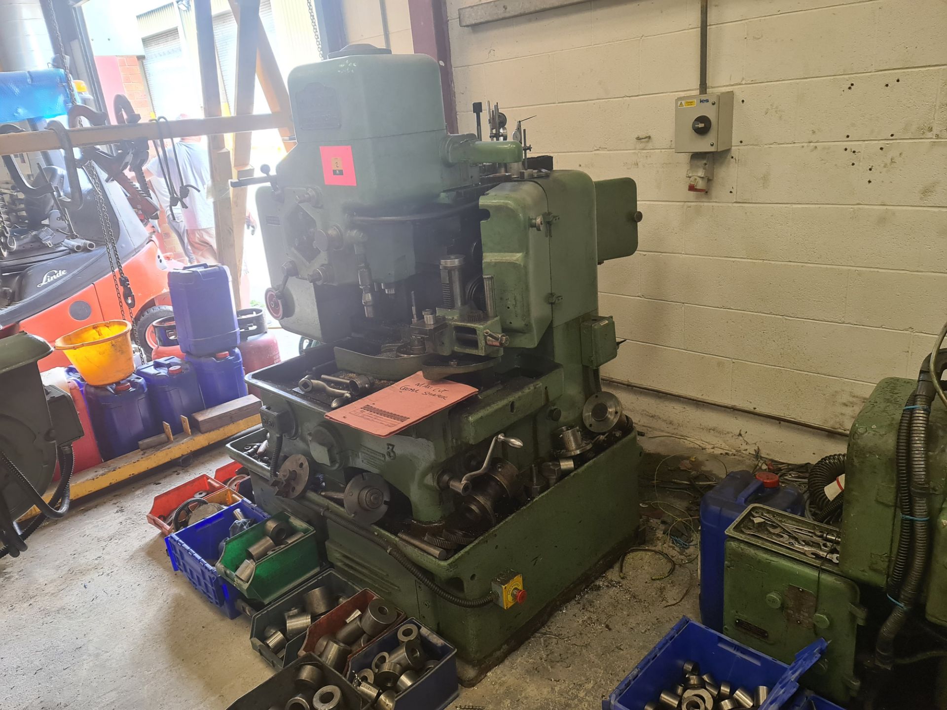 Maxicut number 2A gear shaping machine including the crates & contents immediately surrounding the m