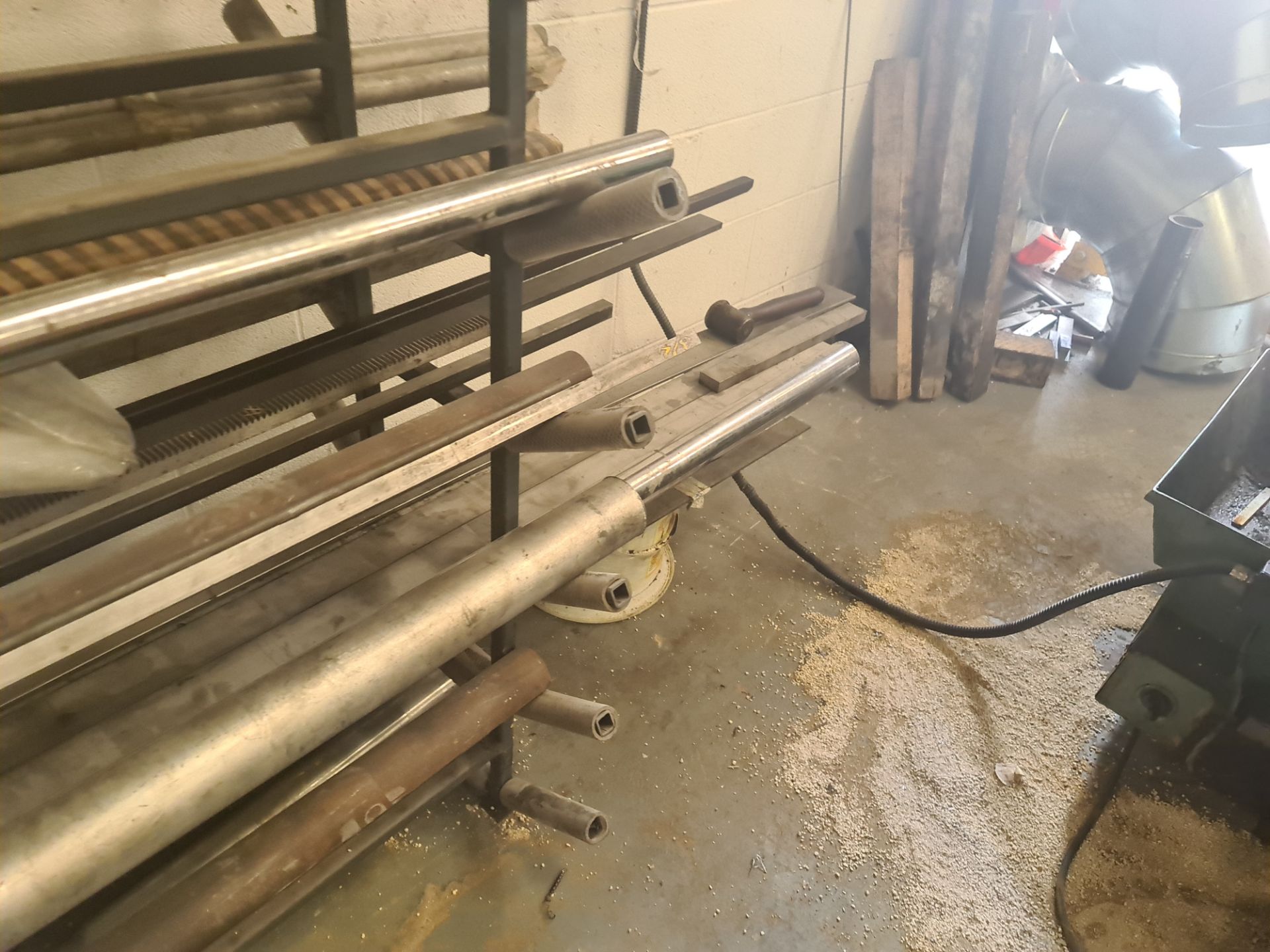 Quantity of rod & bar stock comprising 2 stands & their contents plus the loose metal located adjace - Image 11 of 18