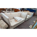 Pair of Knoll settees in cream brocade. NB please note damage to both sofas