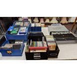 The contents of a table of audio-visual media comprising DVDs, VHS tapes, CDs & more. Includes Jame