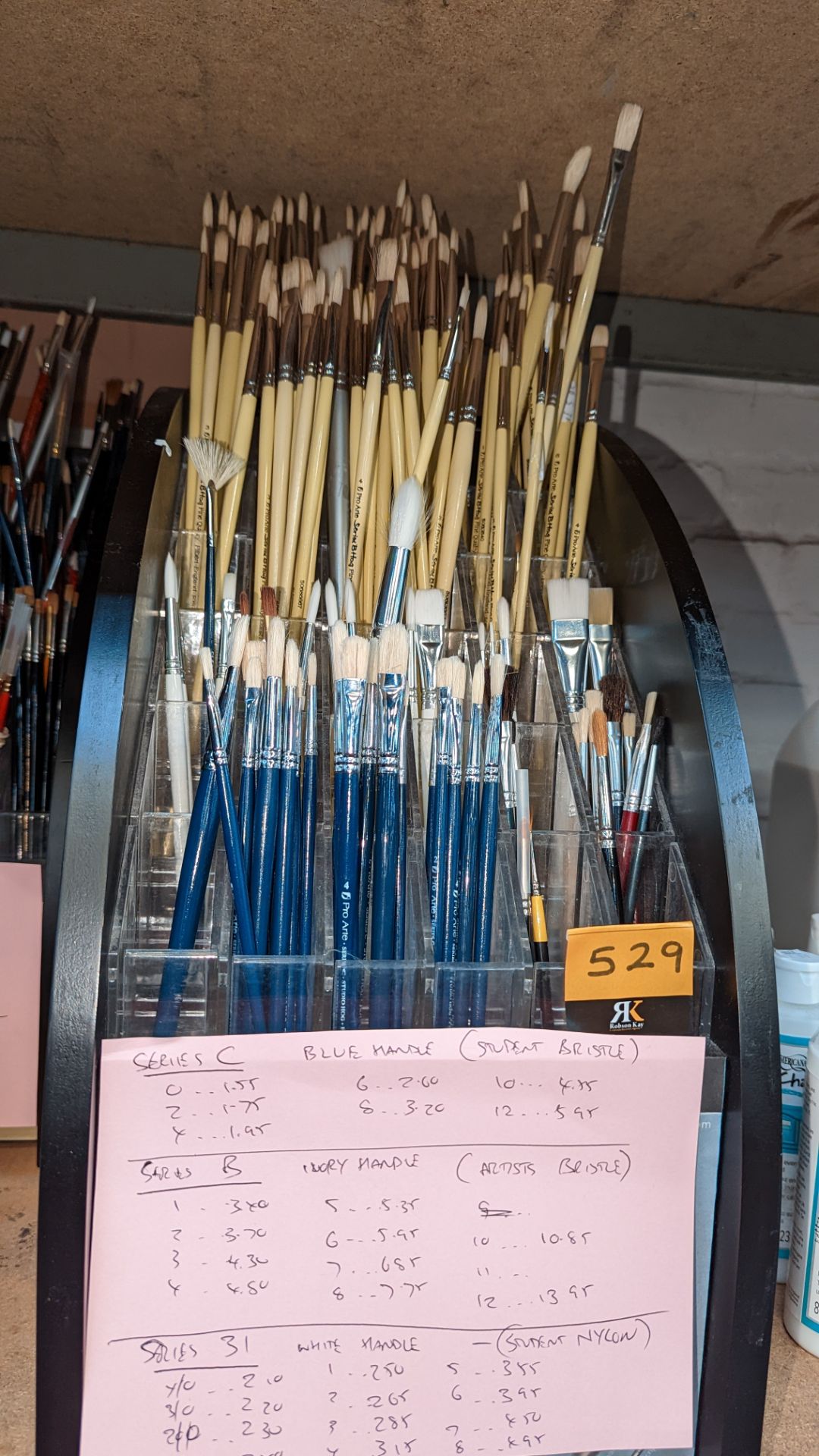 Quantity of paintbrushes comprising stand & contents