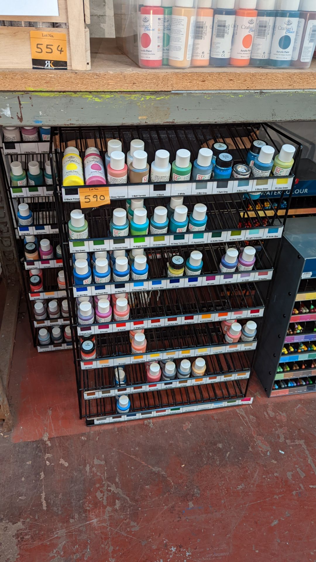 2 stands & their contents comprising a large quantity of miniature paints