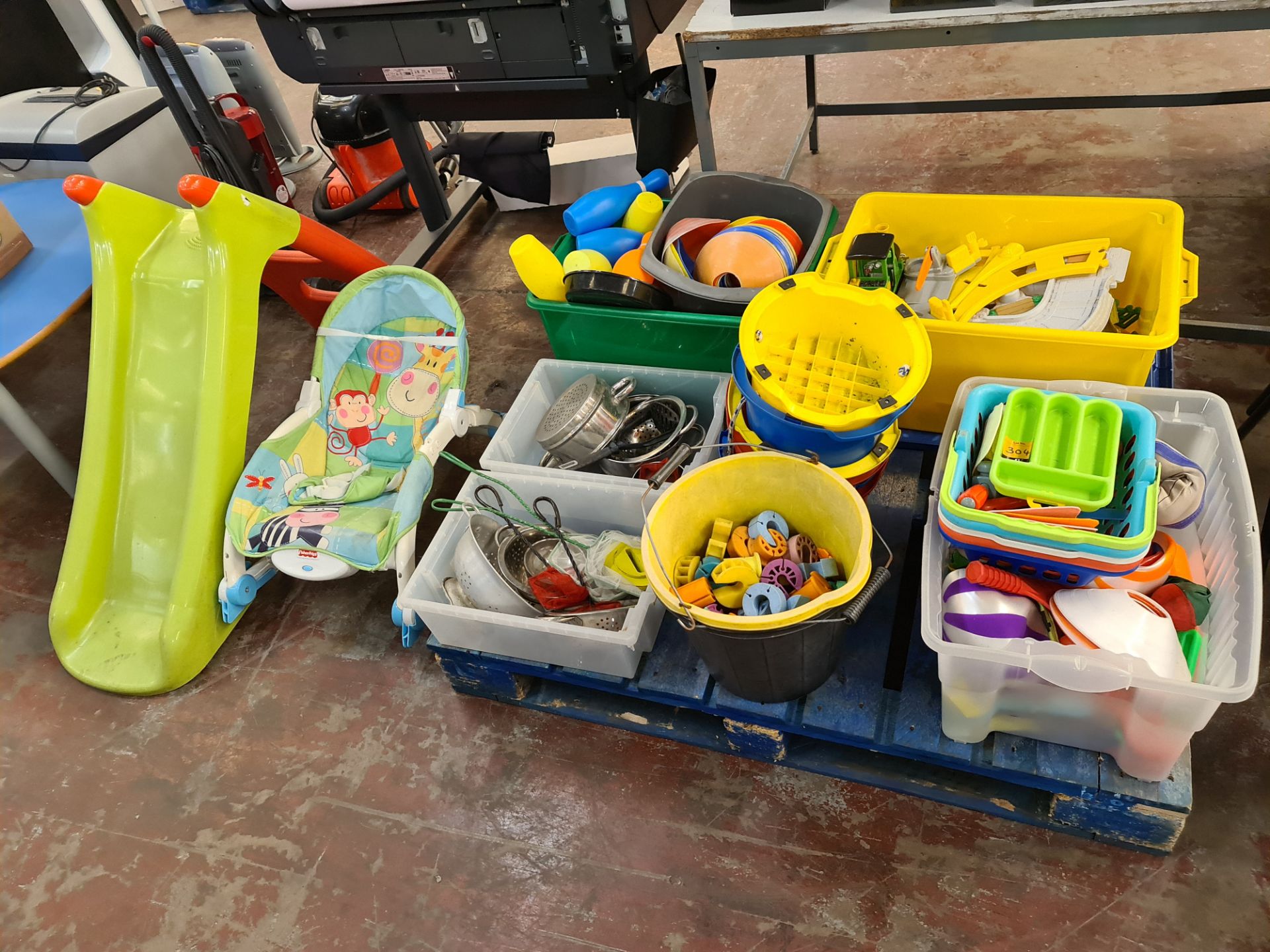 Contents of a pallet of children's toys & similar, plus slide & baby rocker located to the side as p