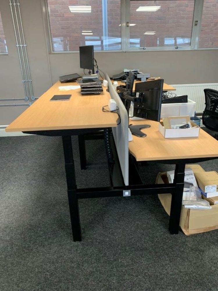 31 sit stand Electrically Operated backtoback Premium Desks, cost £1,236 + VAT per desk in 2020