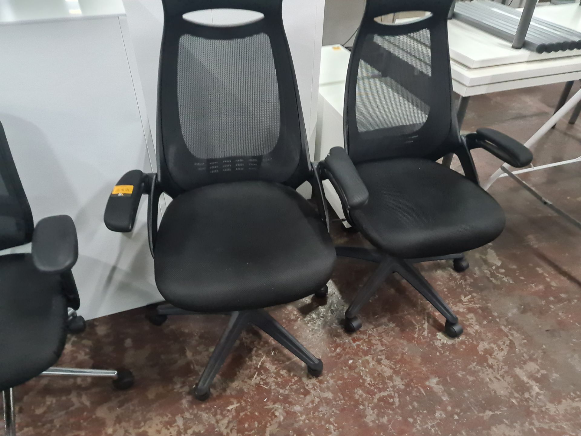 Pair of matching modern high mesh back operator chairs