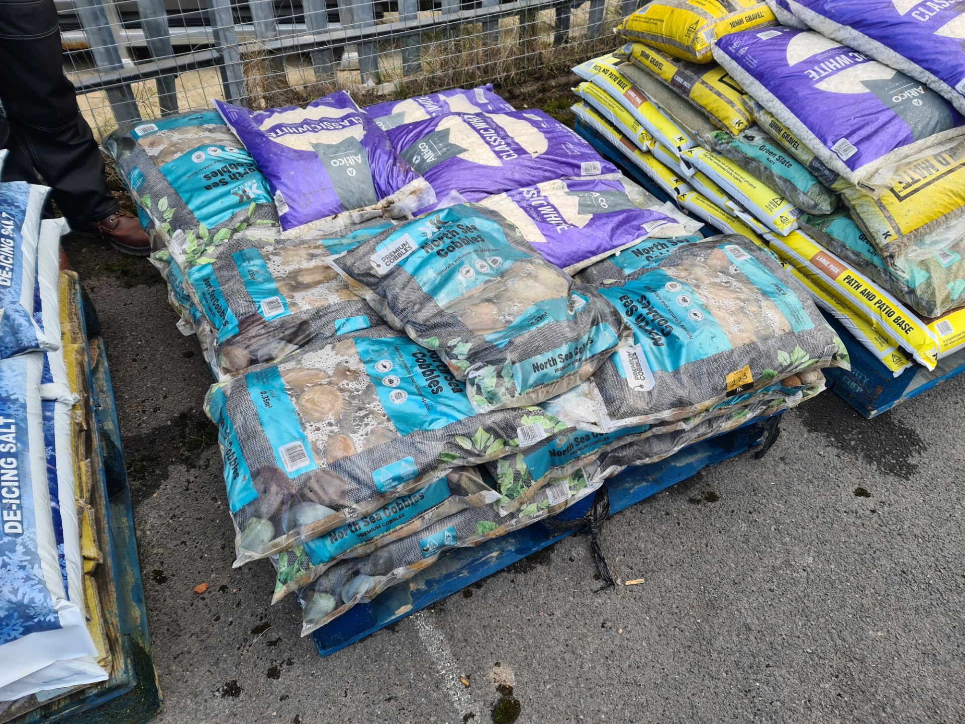 The contents of a pallet of North Sea cobbles and classic white premium stone chippings. Pallet exc