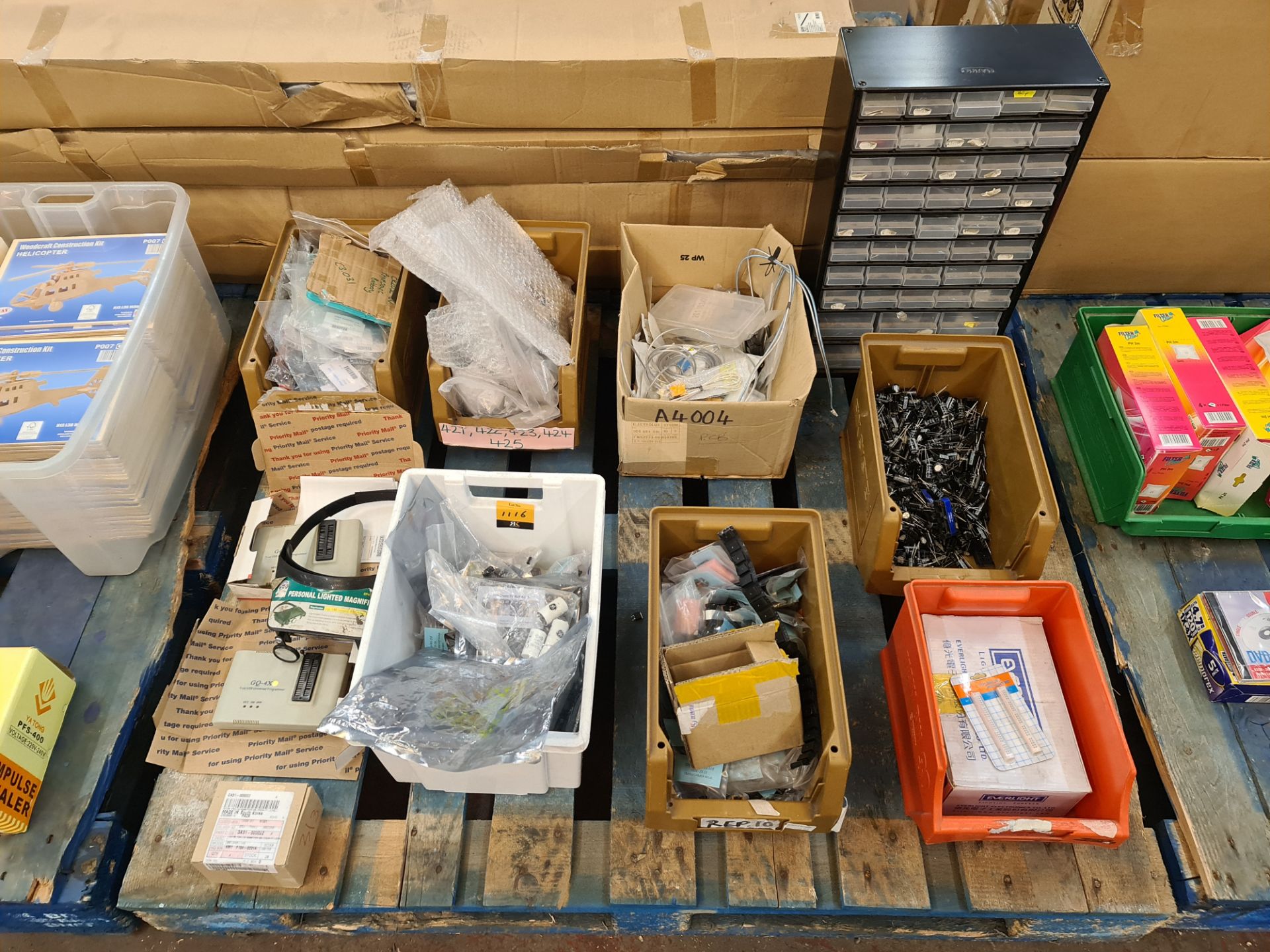 The contents of a pallet of assorted components, parts and spares