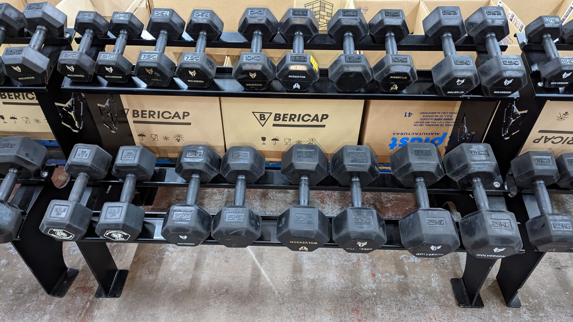 Rack and contents of Wolverson dumbbells. This lot comprises a two tier rack plus nine pairs of dum