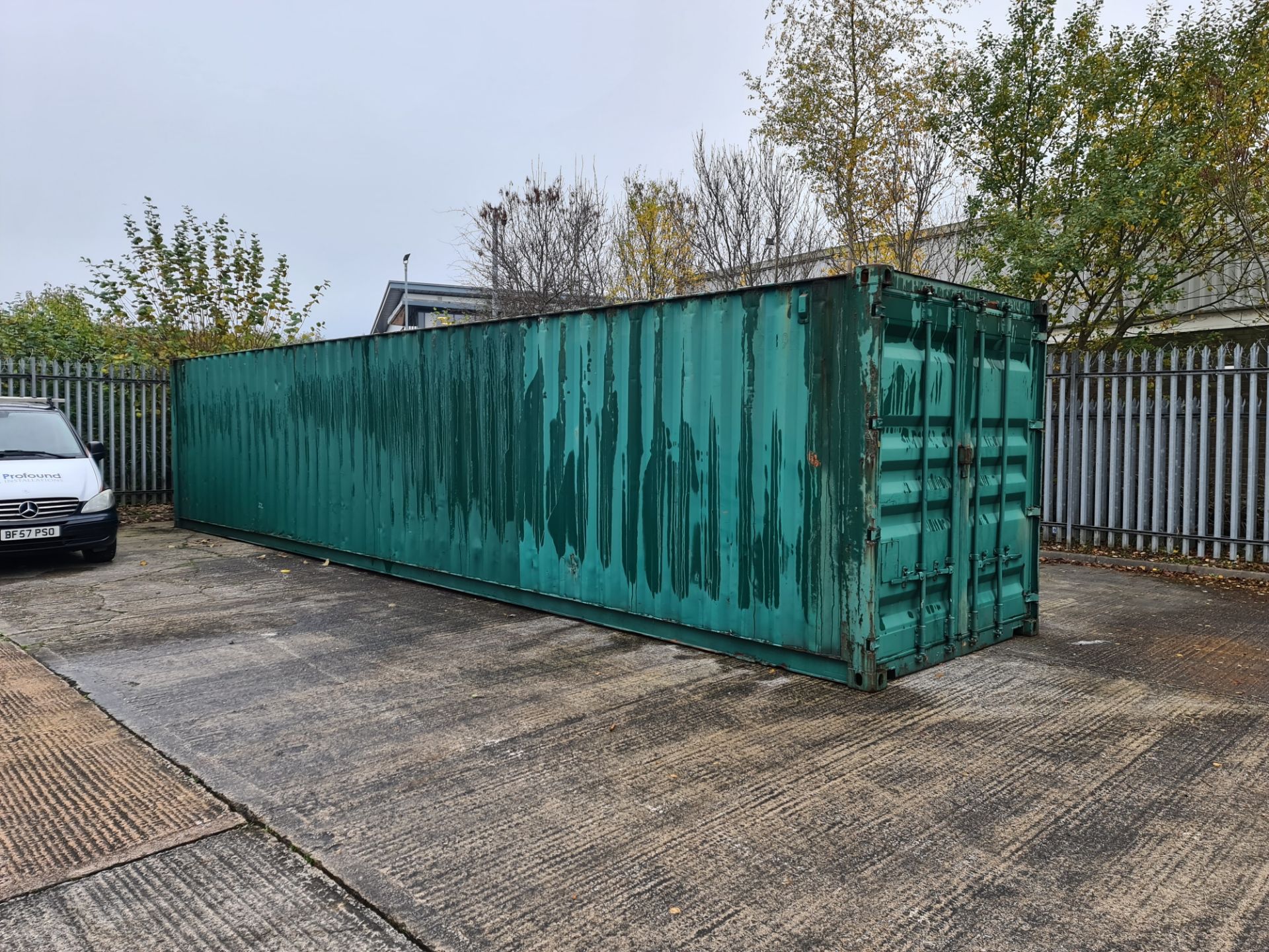 Shipping container, 40 foot in length including contents. The contents appear to comprise flatpack