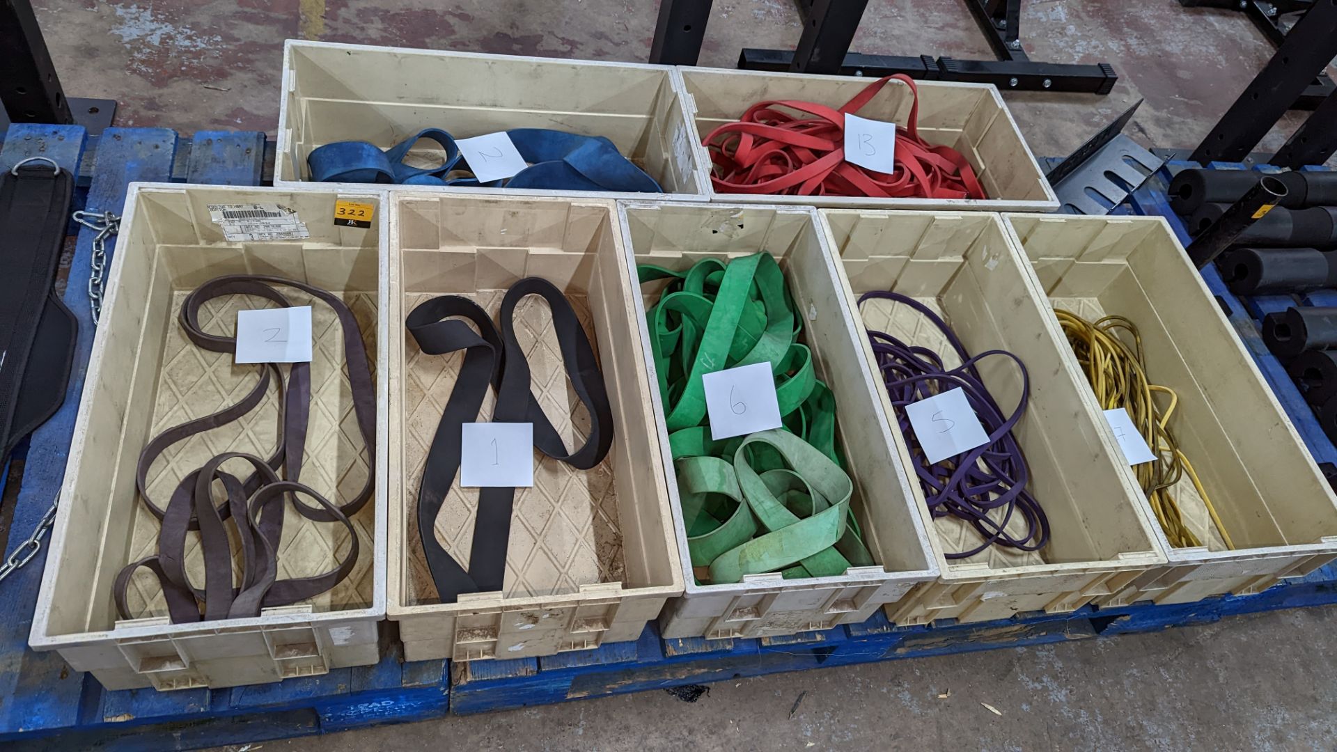 Large quantity of rubber resistance bands comprising the contents of seven crates, each crate holdin