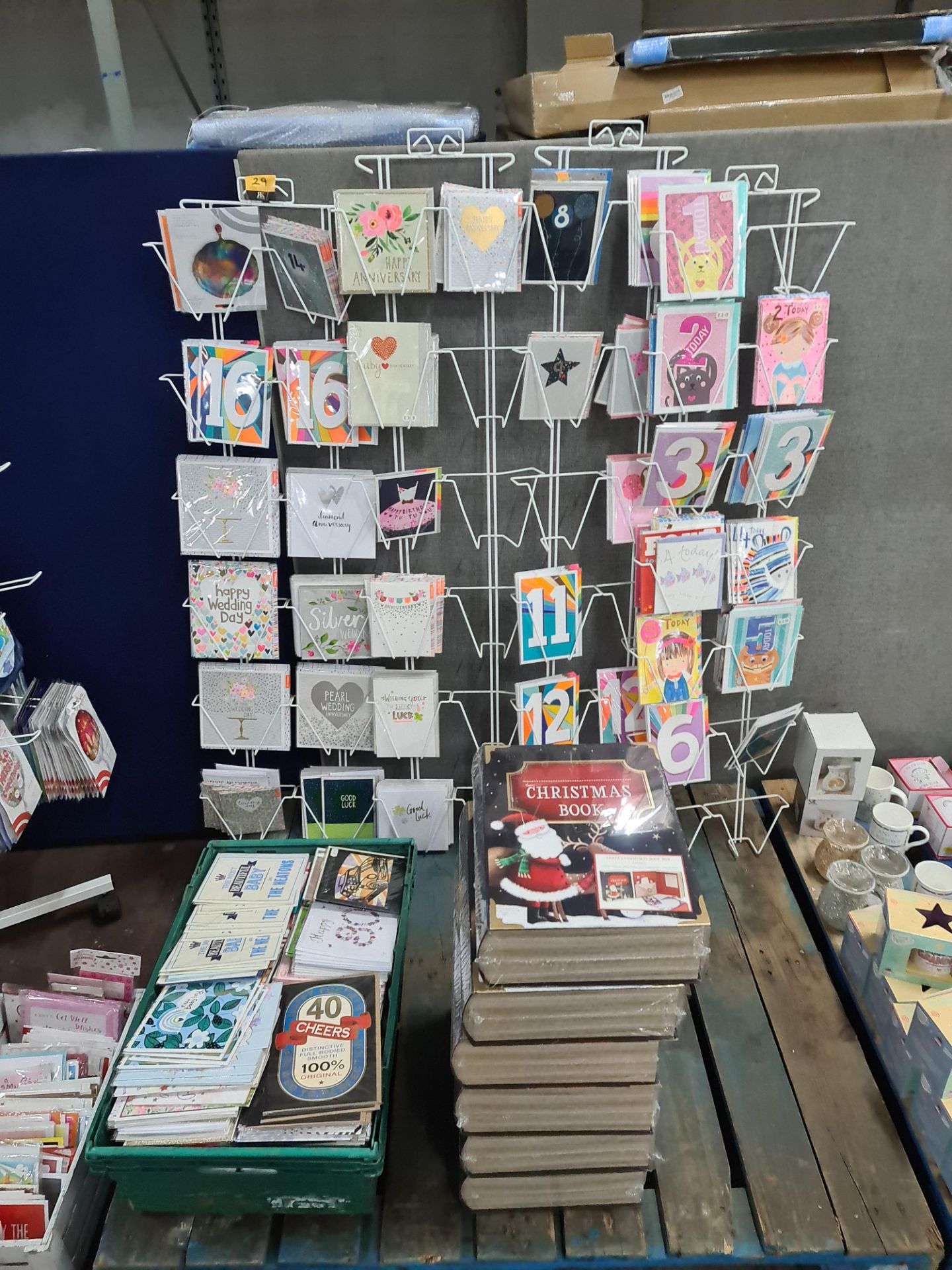 Large quantity of greeting cards - this lot comprises four wall mountable racks and their contents p