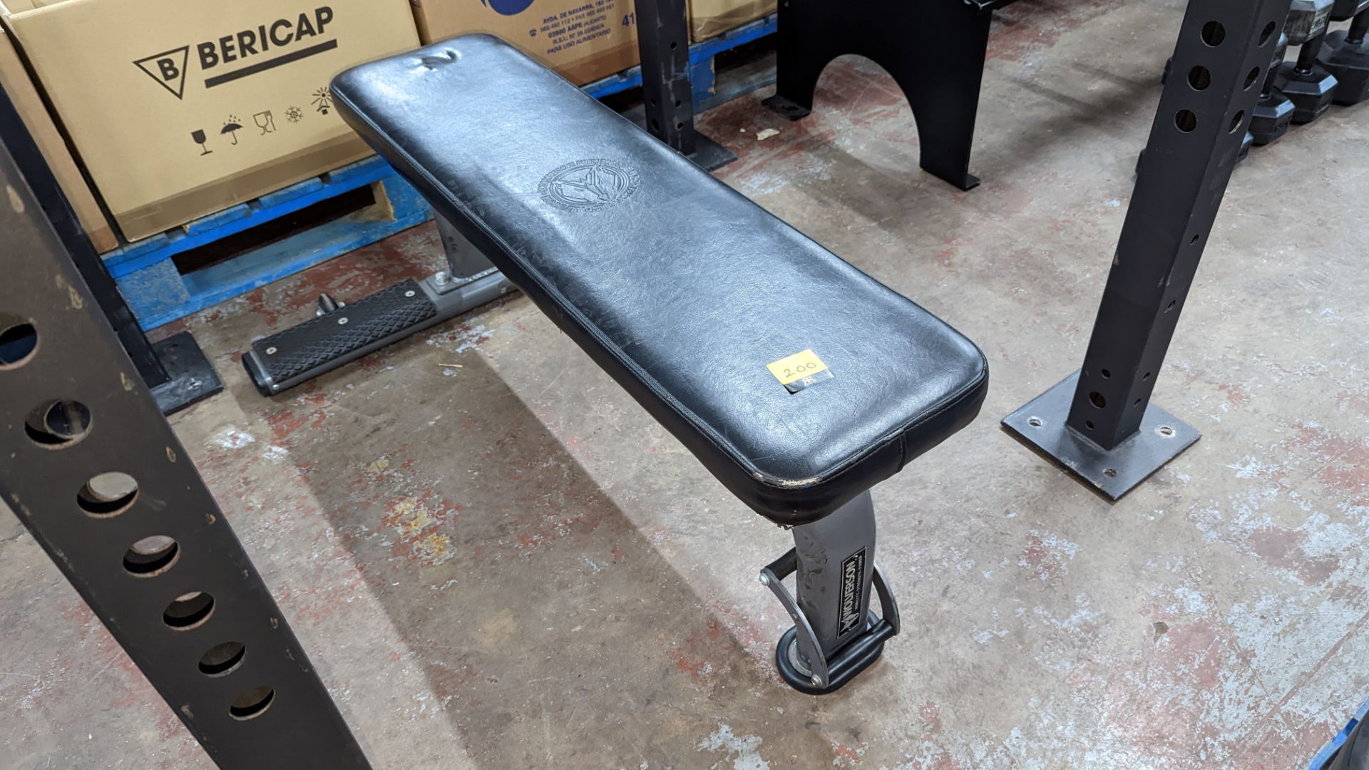 Wolverson padded gym bench, including wheels for easy mobility. NB - the large frame that can be se