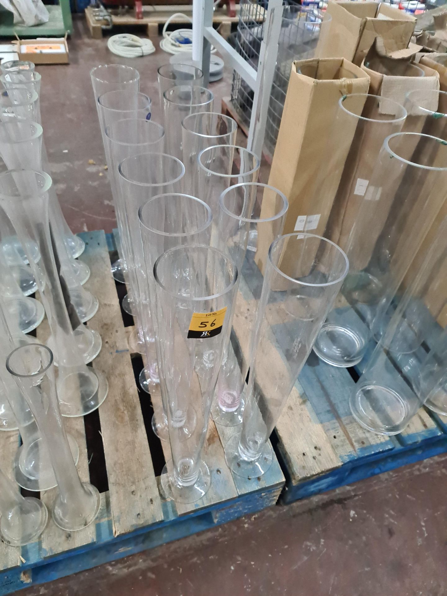 12 off glass vases, approximately 60 cms tall