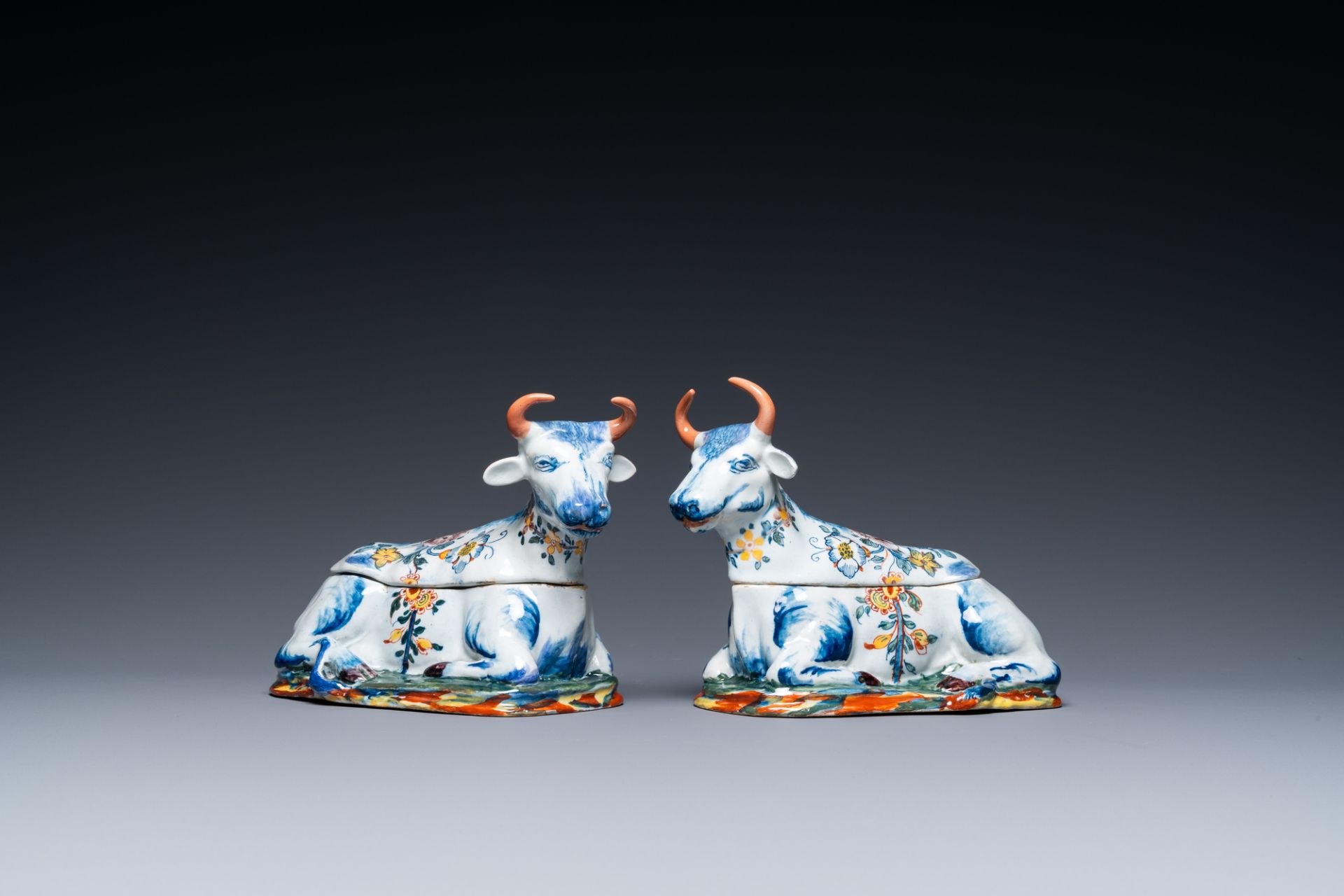 A pair of polychrome Dutch Delft cow-shaped tureens, 18th C.