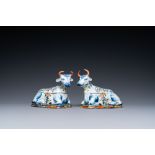 A pair of polychrome Dutch Delft cow-shaped tureens, 18th C.