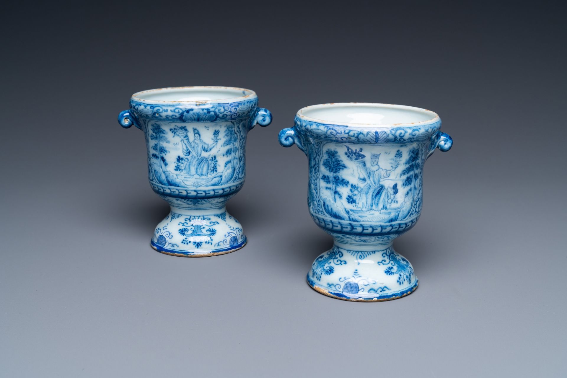 A pair of small Dutch Delft blue and white jardinires, 18th C.
