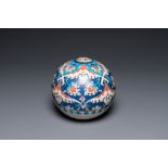 An Iznik-style ball-shaped hanging ornament, Kutahya, Turkey, 19th C.