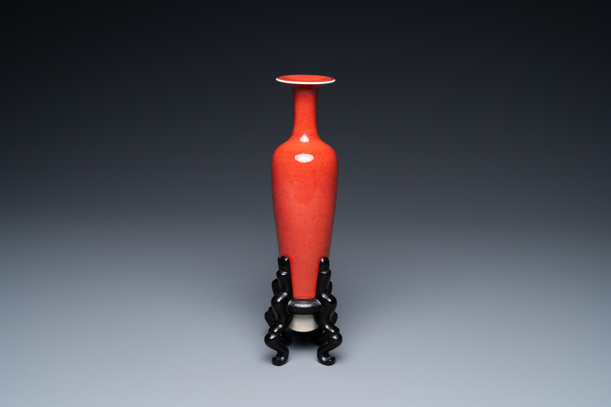 A Chinese slender 'peach bloom'-glazed vase, Kangxi mark but probably later