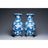 A pair of Chinese blue and white 'dragon and peony' vases, 19th C.