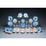 Twenty-two Chinese blue and white and famille rose cups and nineteen saucers, Kangxi and later