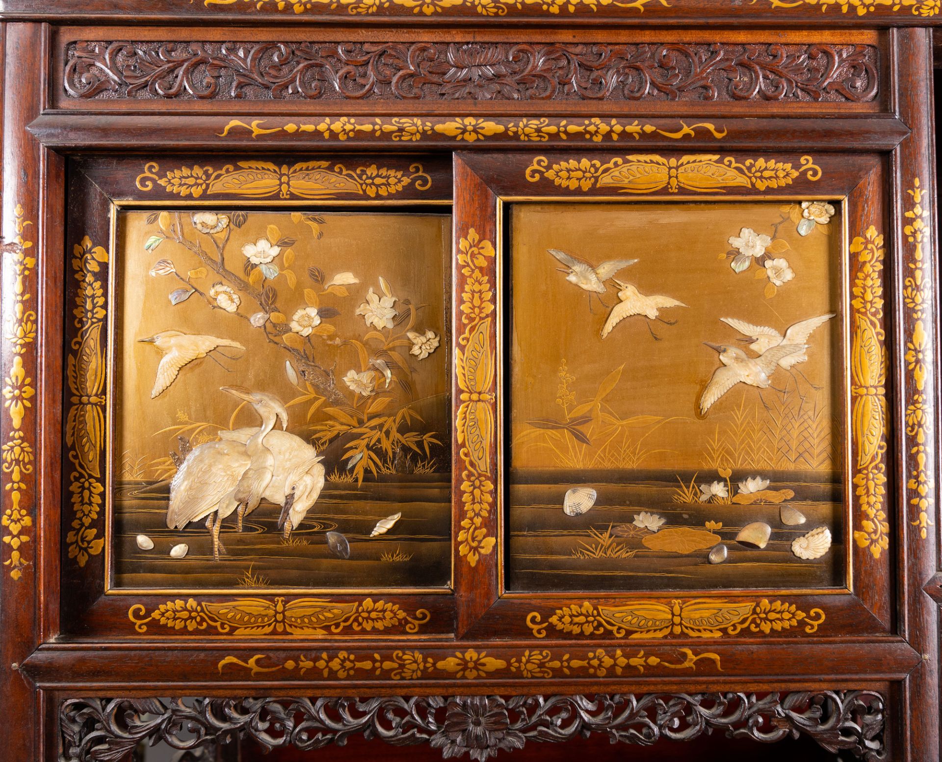 A Japanese 'chigaidansu' gilt-lacquered wood cabinet with finely carved ivory insets, Meiji, 19th C. - Image 3 of 15