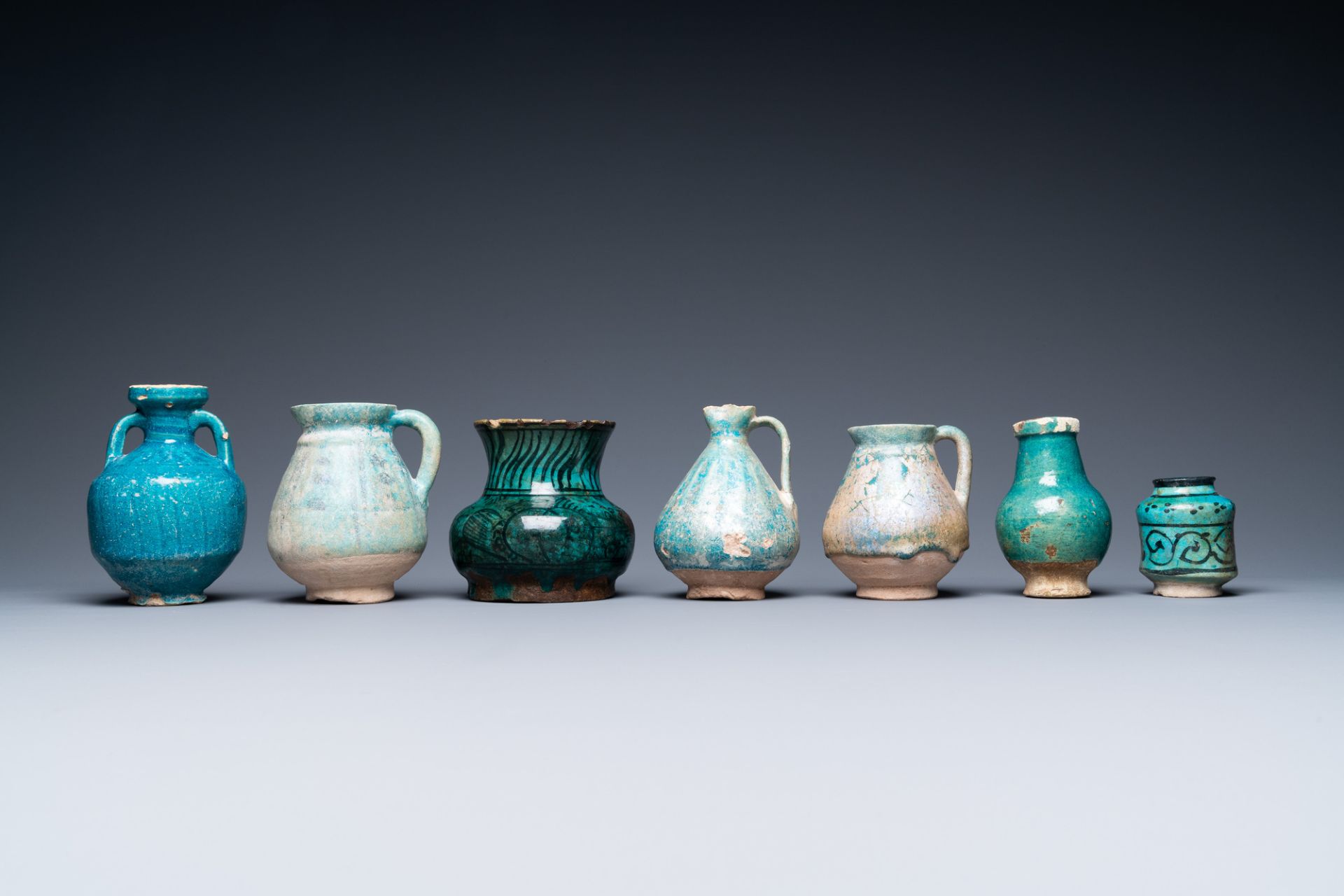 A collection of seven turquoise-glazed jugs and vases, Middle-East, 13th C. and later - Image 2 of 7