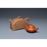 Two Chinese Yixing stoneware teapots with engraved inscriptions, 20th C.