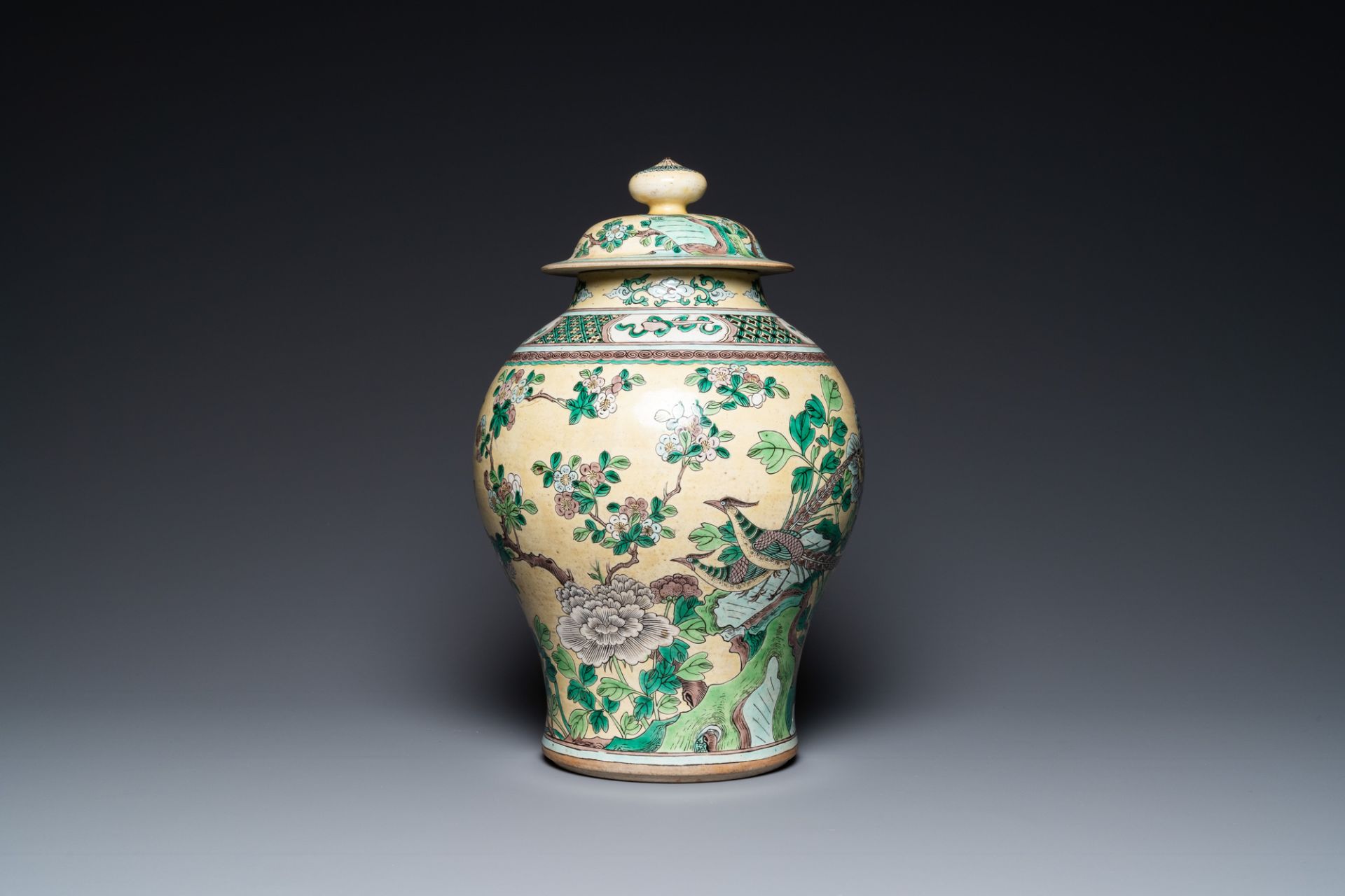 A Chinese yellow-ground verte biscuit vase and cover, 19th C.