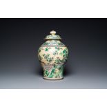 A Chinese yellow-ground verte biscuit vase and cover, 19th C.