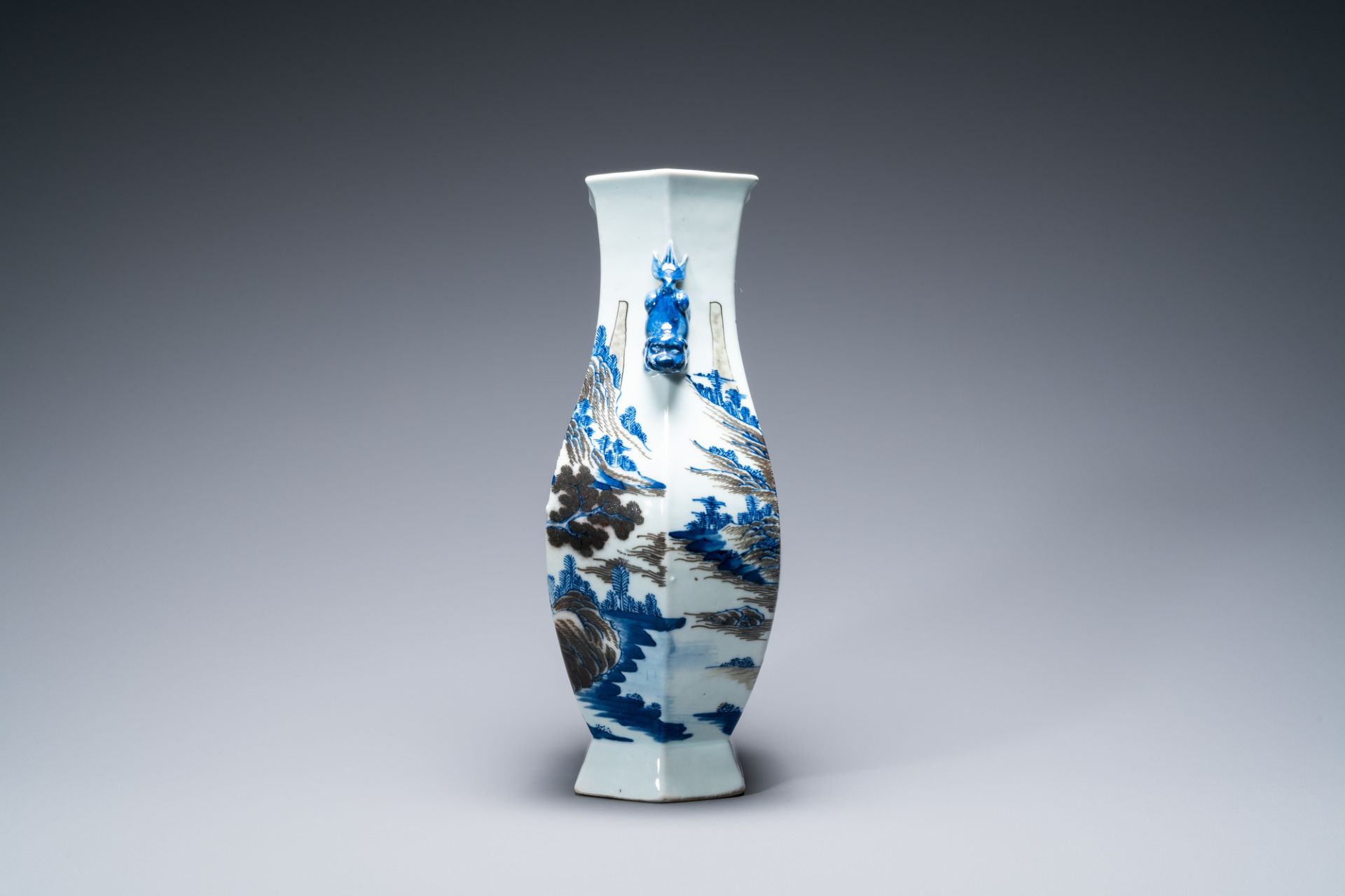A Chinese blue, white and copper-red 'mountainous landscape' vase, 19th C. - Image 4 of 6