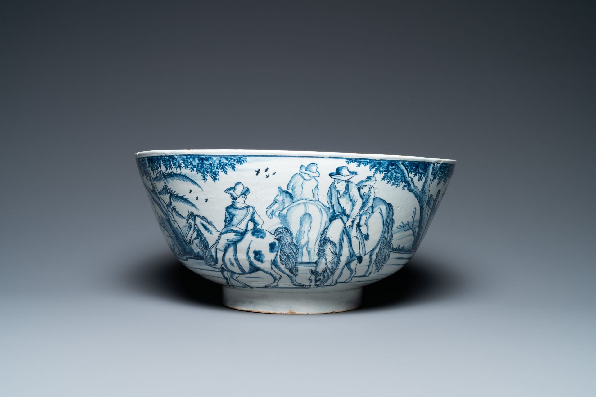 A large Dutch Delft blue and white bowl with shepherds on horsebacks, 18th C. - Image 3 of 9
