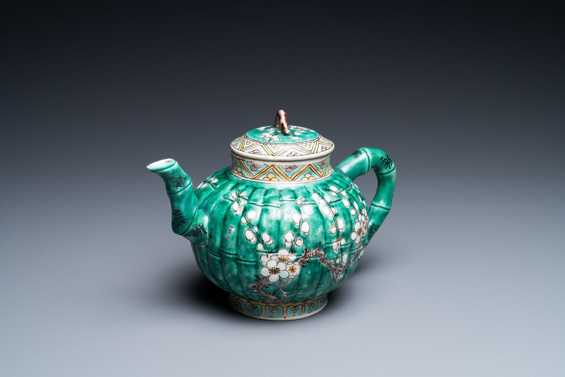 A Chinese ribbed verte biscuit teapot and cover, Kangxi