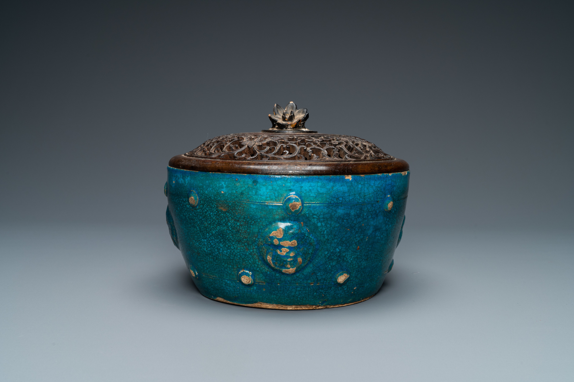 A Chinese monochrome turquoise-glazed bowl with reticulated wooden cover, Ming